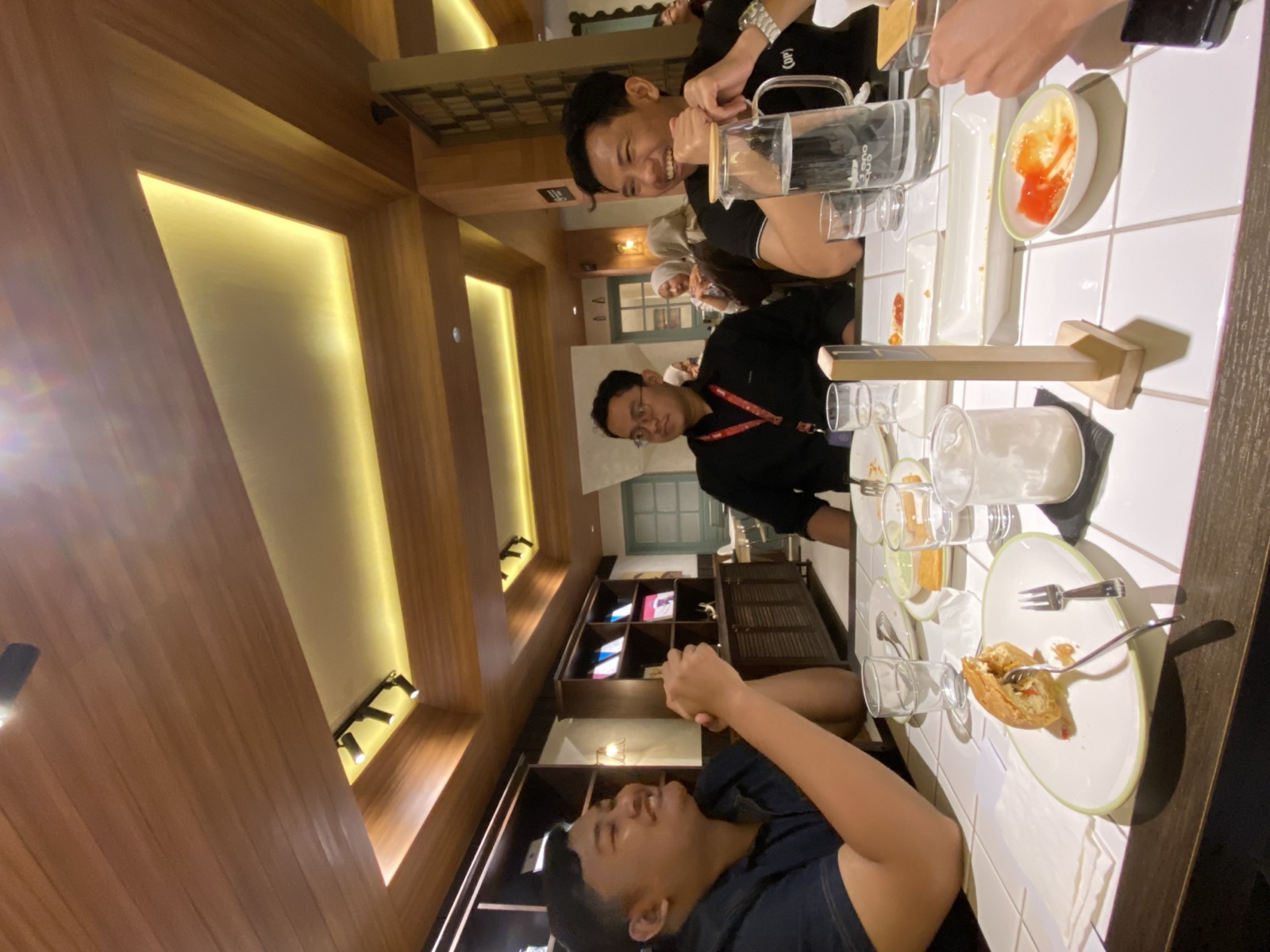Builders in conversation around the table at the Jakarta meetup